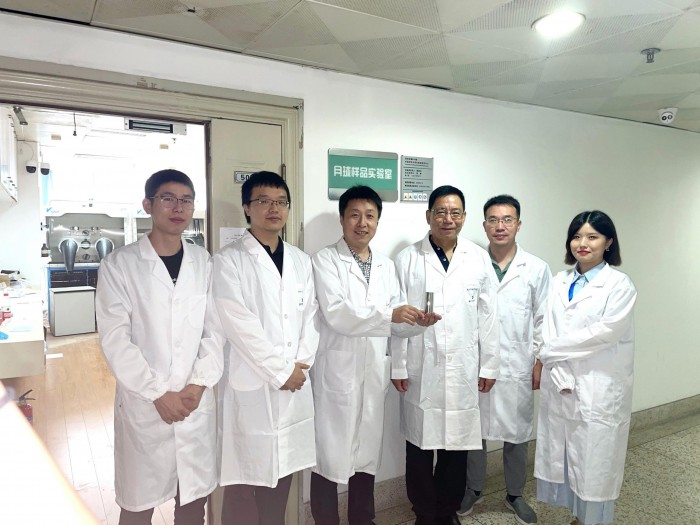 Research-Team-With-Lunar-Soil-Sample-scaled.jpg