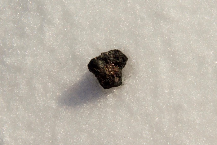 Chebarkul_meteorite_sample_on_lake_ice.jpg